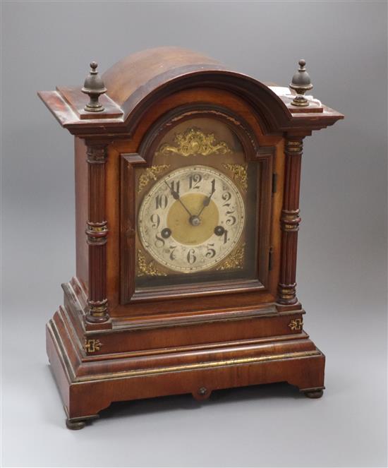 A 1920s dome topped mahogany cased mantle clock, height 35.5cm.